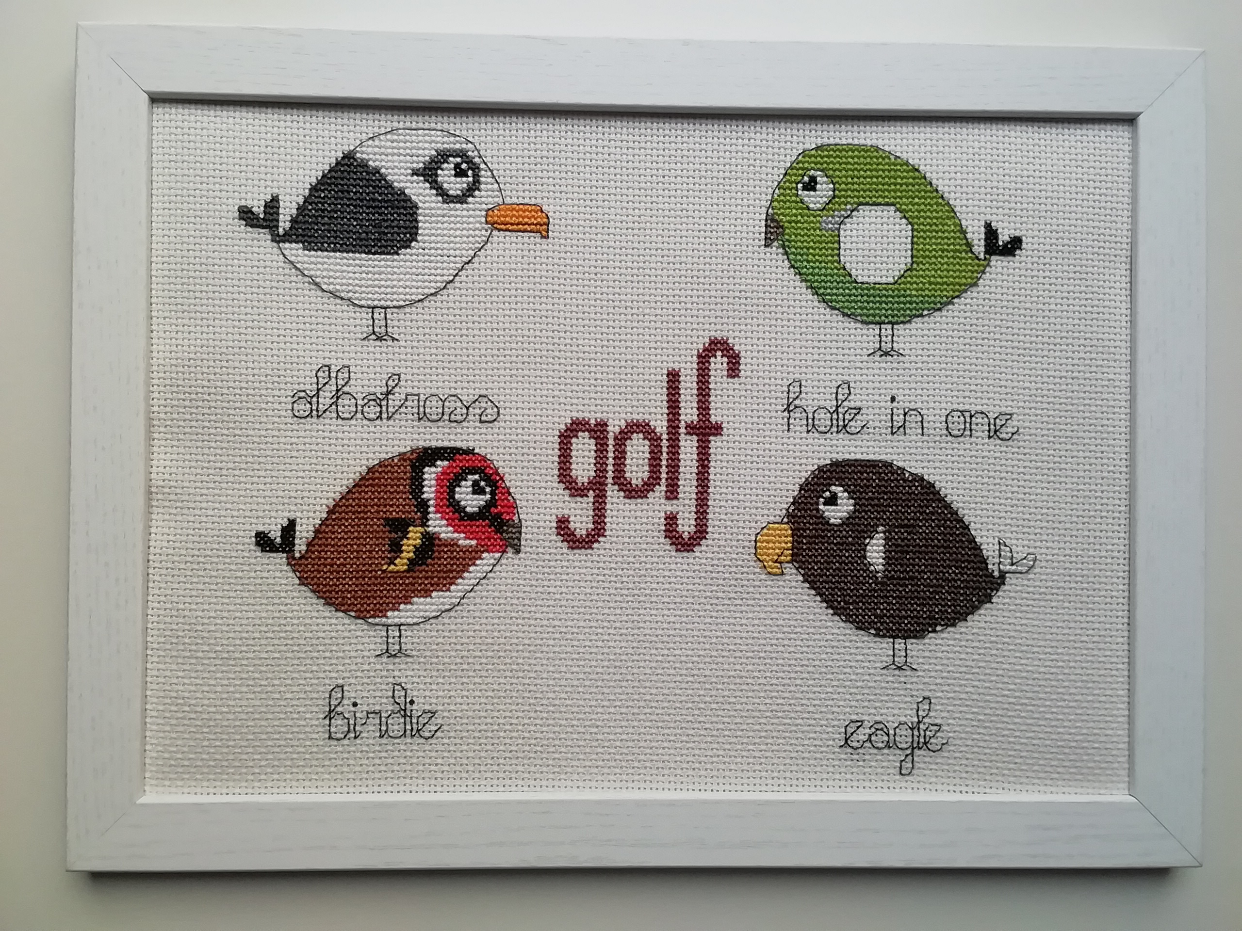 cross stitch of four birds