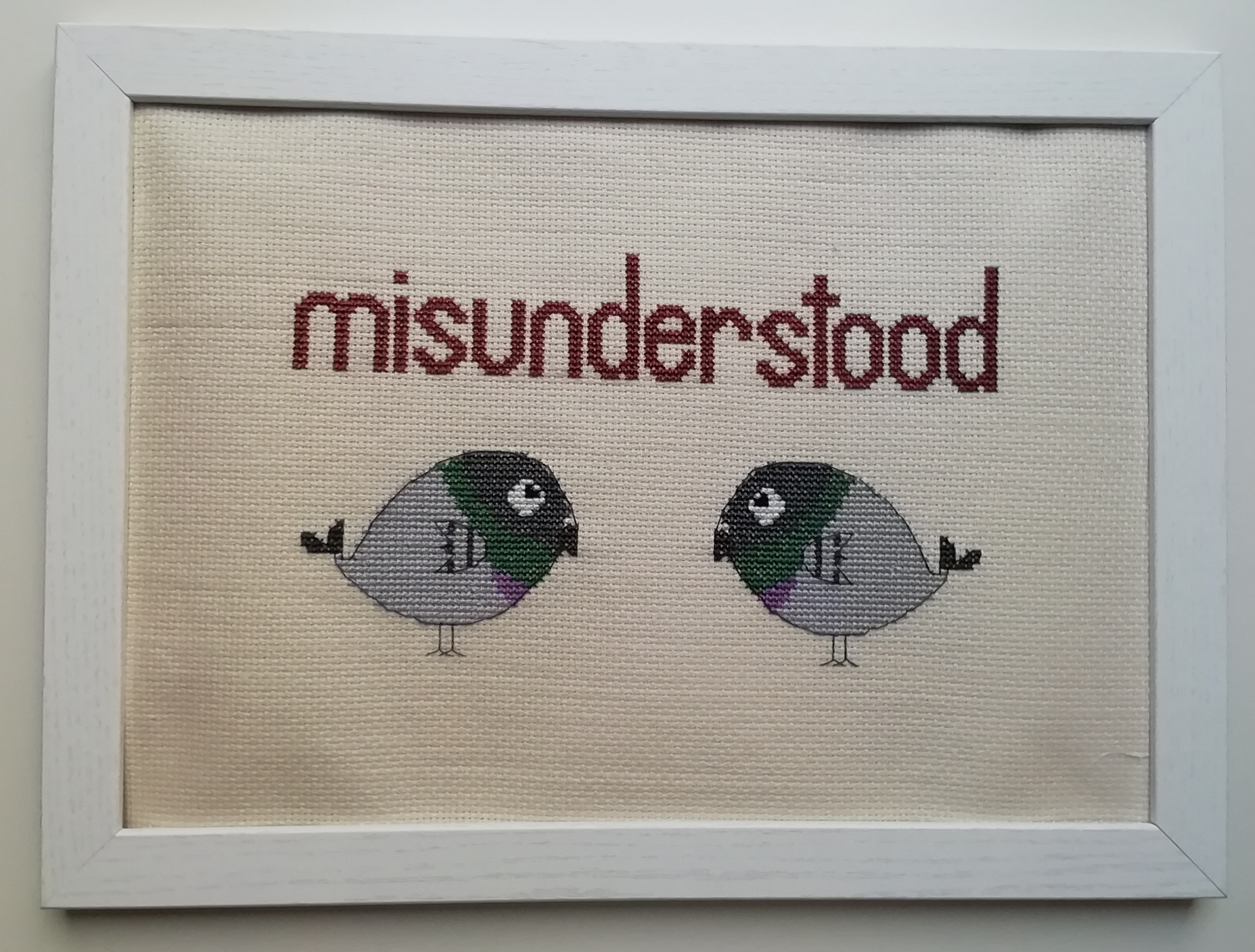 cross stitch of pigeons